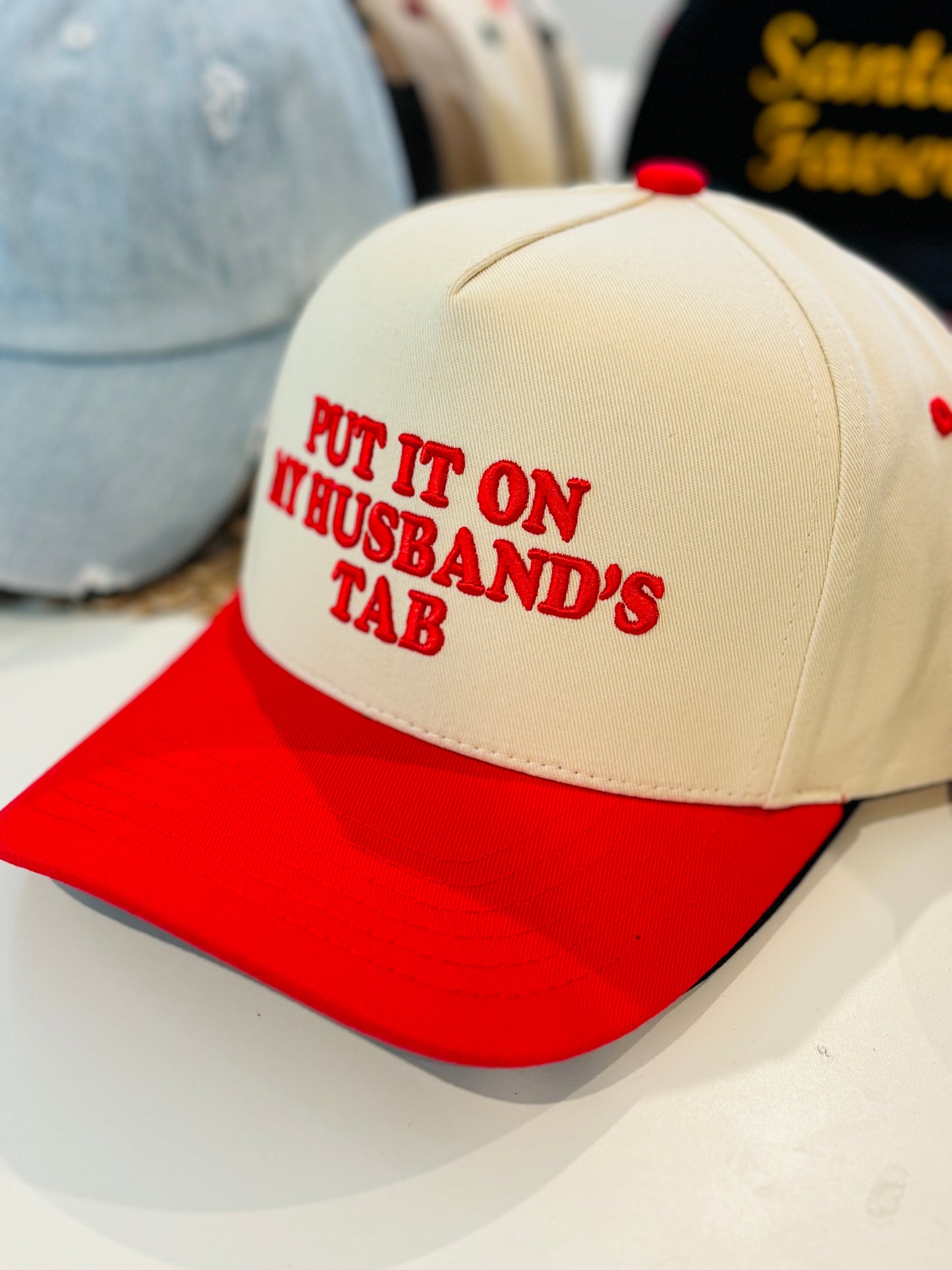 Put It on My Husband’s Tab” Embroidered Two-Tone Trucker Hat (6pk)